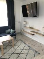 Televízia a/alebo spoločenská miestnosť v ubytovaní Apart 20
