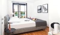Posteľ alebo postele v izbe v ubytovaní Rivus Apartments