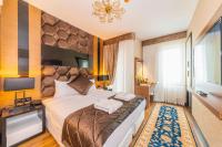 Postel nebo postele na pokoji v ubytování Eastanbul Suites