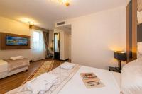 Postel nebo postele na pokoji v ubytování Eastanbul Suites