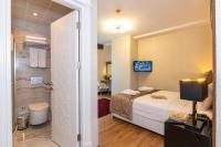 Postel nebo postele na pokoji v ubytování Eastanbul Suites