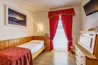 Posteľ alebo postele v izbe v ubytovaní Hotel Aquila