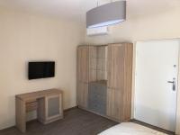 A television and/or entertainment centre at Napsugár Club és Panzió