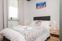 Posteľ alebo postele v izbe v ubytovaní Stare Bielany 2-Bedroom Apartment