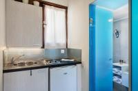 Kuchyň nebo kuchyňský kout v ubytování Magia Apartments