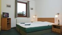 Postel nebo postele na pokoji v ubytování Pension Aspen Harrachov
