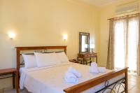Postel nebo postele na pokoji v ubytování Ammoudara Beach Hotel Apartments
