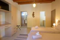Postel nebo postele na pokoji v ubytování Ammoudara Beach Hotel Apartments