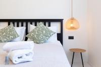 Postel nebo postele na pokoji v ubytování Twins Idola Apartments