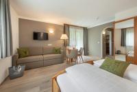 A bed or beds in a room at Hotel Dosses