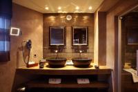 two sinks on a counter in a bathroom at Hotel Le Saint Roch in Courchevel