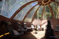 a group of chairs in a room with a large window at Domaine du Hirtz, Restaurant &amp; Spa in Wattwiller