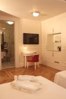 Postel nebo postele na pokoji v ubytování Corinne Art & Boutique Hotel