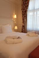 Postel nebo postele na pokoji v ubytování Corinne Art & Boutique Hotel