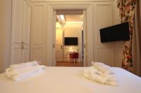 Postel nebo postele na pokoji v ubytování Corinne Art & Boutique Hotel