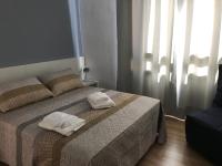 Postel nebo postele na pokoji v ubytování Hostal Casiano Camarasa
