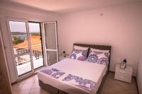 Posteľ alebo postele v izbe v ubytovaní Ceratonia Apartments