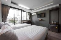 Postel nebo postele na pokoji v ubytování Bangkok City Link Hotel