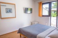 Łóżko lub łóżka w pokoju w obiekcie Rooms Stolfa