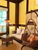 a living room with a couch and a swing at Rothenburg Lodge in Wujie