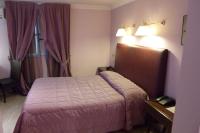 A bed or beds in a room at Hotel Palma