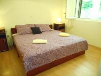 Postel nebo postele na pokoji v ubytování Apartments Maja 221