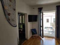 TV a/nebo společenská místnost v ubytování Apartment Doris