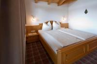 Posteľ alebo postele v izbe v ubytovaní Gästehaus Brantlhof Zimmer und Ferienwohnungen in Going am Wilden Kaiser