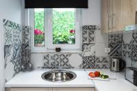 Kuchyň nebo kuchyňský kout v ubytování NK Apartments