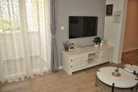 Televízia a/alebo spoločenská miestnosť v ubytovaní Split Apartment M&T