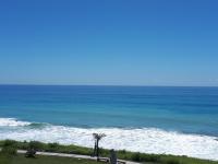 a view of the ocean with a palm tree at Sunny Ocean B&amp;B in Yanliau