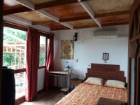 A bed or beds in a room at VLASSIS APTS -ΜΕΛΙΔΟΝΙ-ΔΙΑΜΕΡΙΣΜΑ ΒΑΣΙΛΙΚΗ