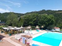 a view of a swimming pool at a resort at Camping La Bohème in Tournon-sur-Rhône