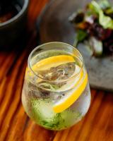 a glass of water with a lemon slice in it at Encuentro Guadalupe in Valle de Guadalupe