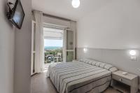 Posteľ alebo postele v izbe v ubytovaní Hotel Blues