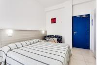 Posteľ alebo postele v izbe v ubytovaní Hotel Blues