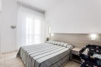 Posteľ alebo postele v izbe v ubytovaní Hotel Blues