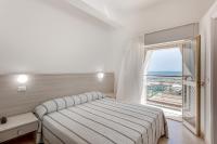 Posteľ alebo postele v izbe v ubytovaní Hotel Blues