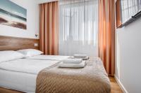 Posteľ alebo postele v izbe v ubytovaní Apartament przy Plaży / Klifowa