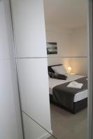 Posteľ alebo postele v izbe v ubytovaní Apartments Paradise Hvar