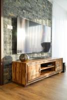 Televízia a/alebo spoločenská miestnosť v ubytovaní Luxury Villa