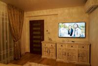Televízia a/alebo spoločenská miestnosť v ubytovaní Luxury Villa
