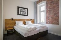 Łóżko lub łóżka w pokoju w obiekcie Loft Apartments Poznań
