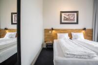 Łóżko lub łóżka w pokoju w obiekcie Loft Apartments Poznań