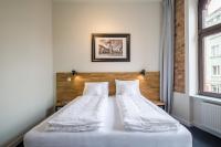 Łóżko lub łóżka w pokoju w obiekcie Loft Apartments Poznań