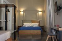 Posteľ alebo postele v izbe v ubytovaní Be Italian Flat Piazza Bovio 22