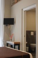 Televízia a/alebo spoločenská miestnosť v ubytovaní Be Italian Flat Piazza Bovio 22