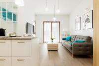 Televízia a/alebo spoločenská miestnosť v ubytovaní Apartments Gdańsk Starowiejska by Noclegi Renters