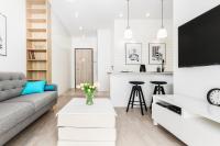 Televízia a/alebo spoločenská miestnosť v ubytovaní Apartments Gdańsk Starowiejska by Noclegi Renters