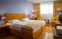 Postel nebo postele na pokoji v ubytování Appartement-Hotel an der Riemergasse